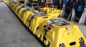 Fleet of Abalones OBS stations strapped down on the deck of a ship