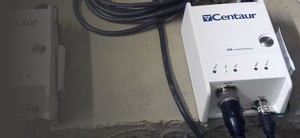 Centaur digitizer resting on a concrete floor connected to a large cable
