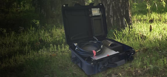 Pegasus deployment kit sitting open in a wooded area