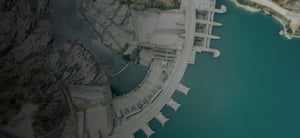 Top view of a hydroelectric dam and a river basin