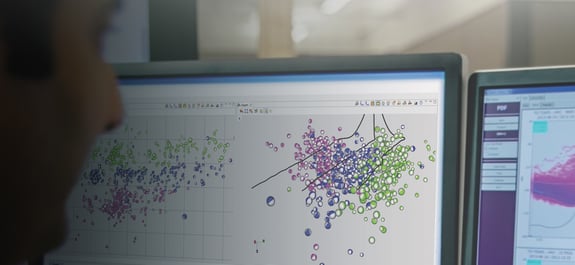 Two computer screens displaying nanometrics seismic data plots
