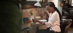 Woman working at a desk in her home office