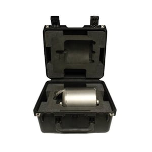 Transport case open with a seismometer inside resting in foam