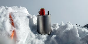 Nanometrics stainless steel seismometer sitting in the snow