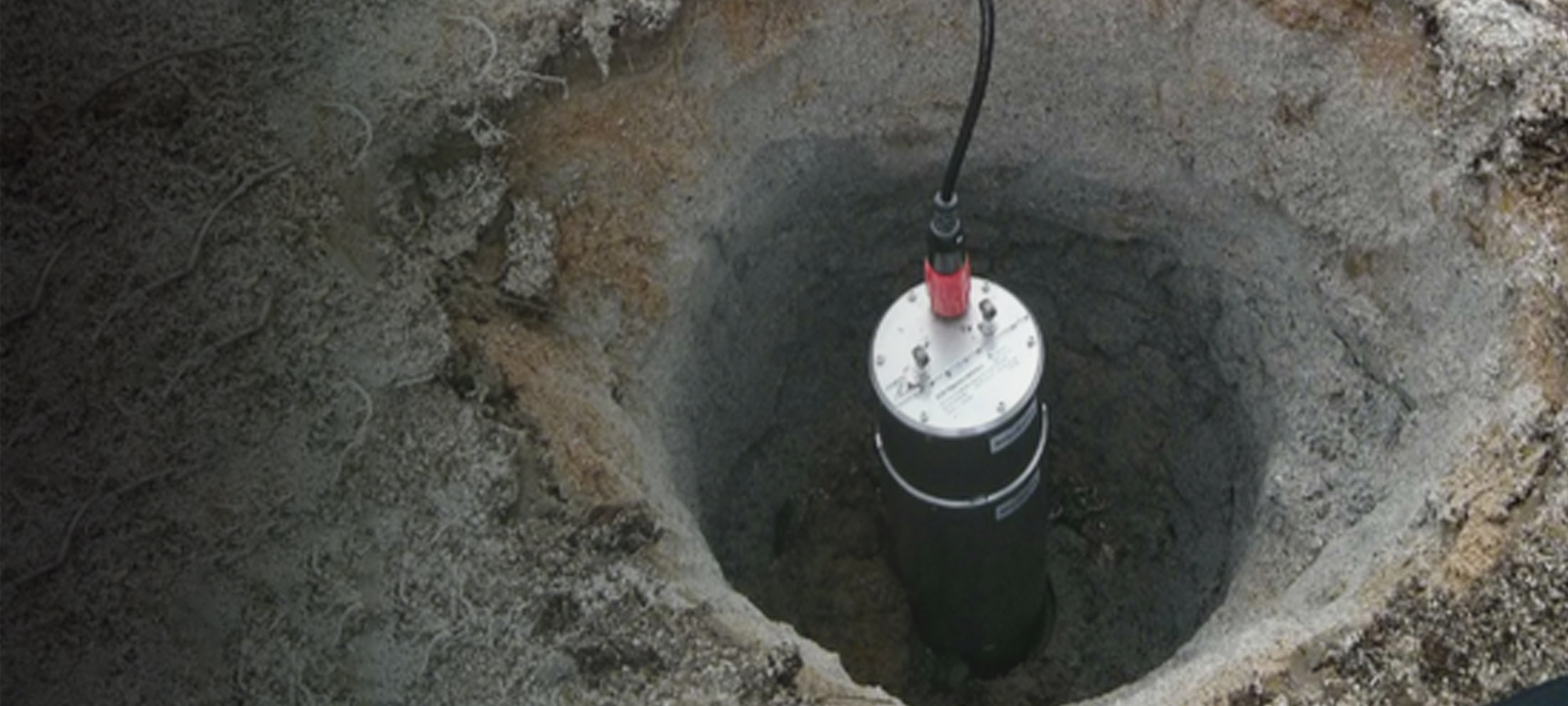 Meridian 120 sitting in a hole dug in the ground.
